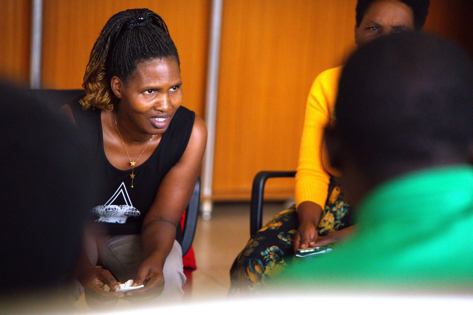 Participants sharing experiences at the Mengo event