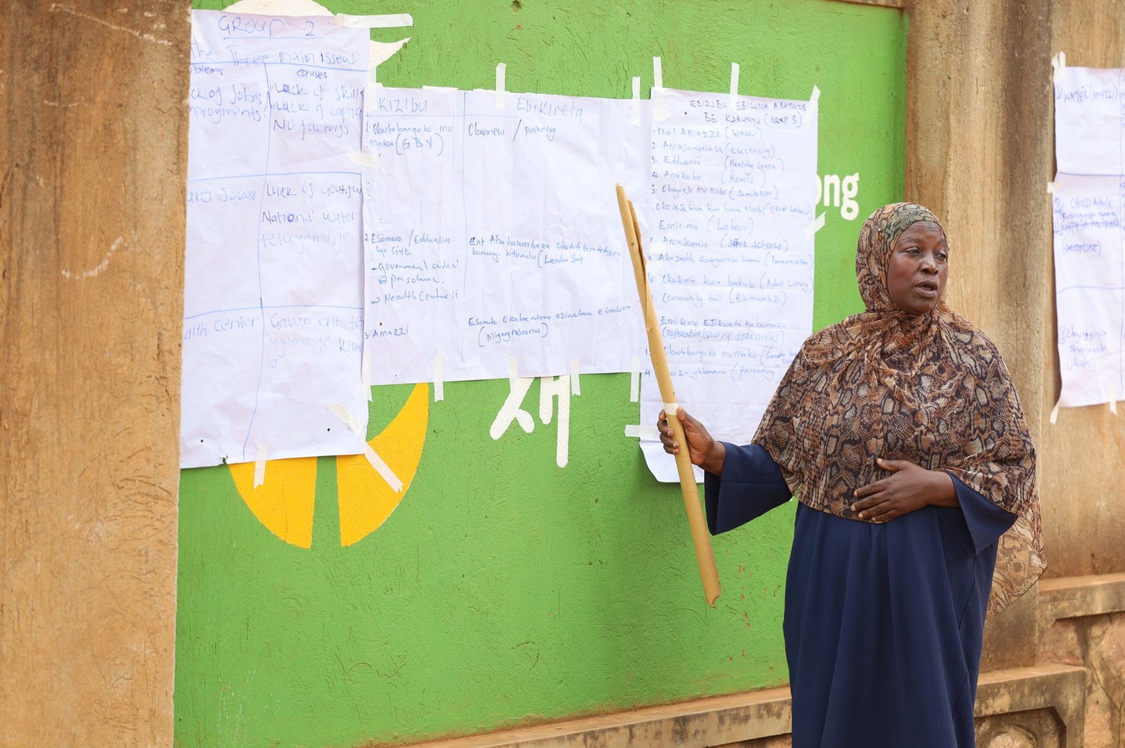 Community leaders and partners discussing borehole expansion
